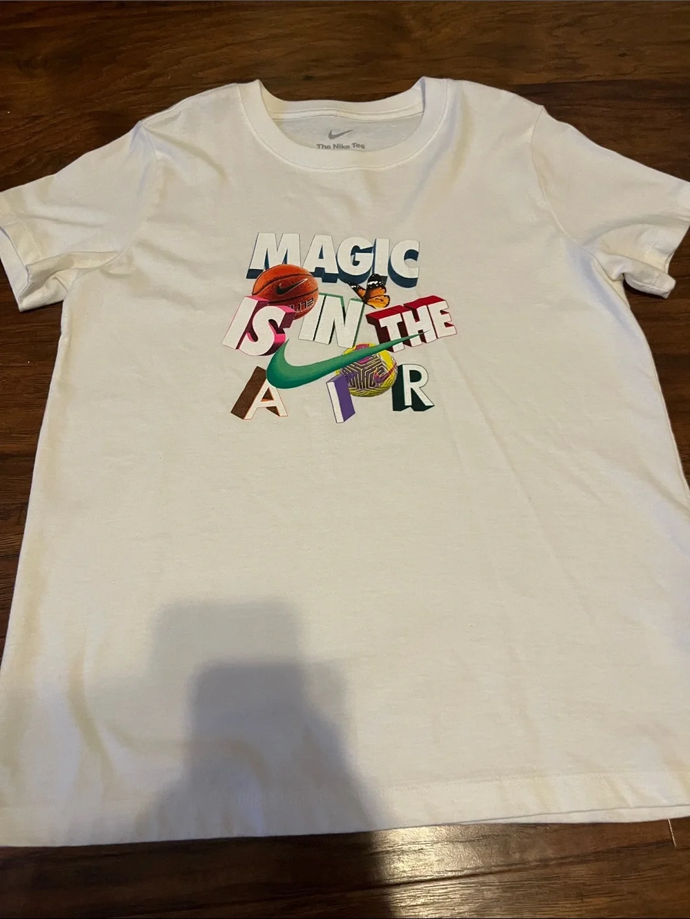 Nike White Kids Graphic Tee with Multicolor 'Magic Is In The Air' Design